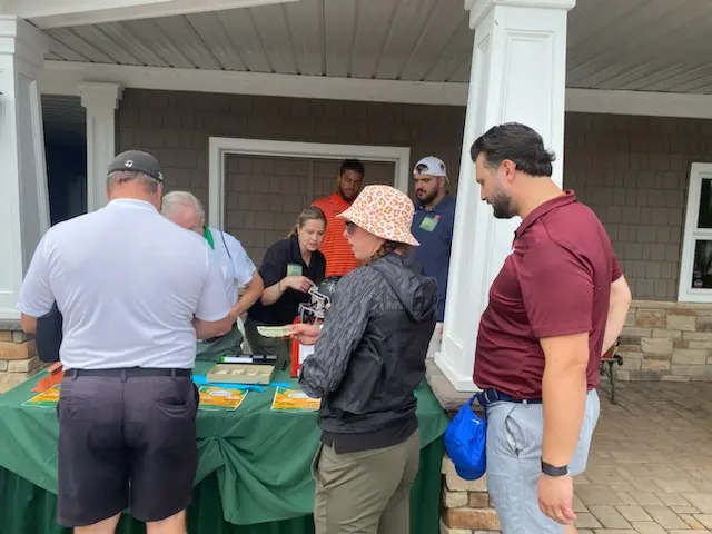 Golfers were eager to purchase raffle tickets before heading out for the day.